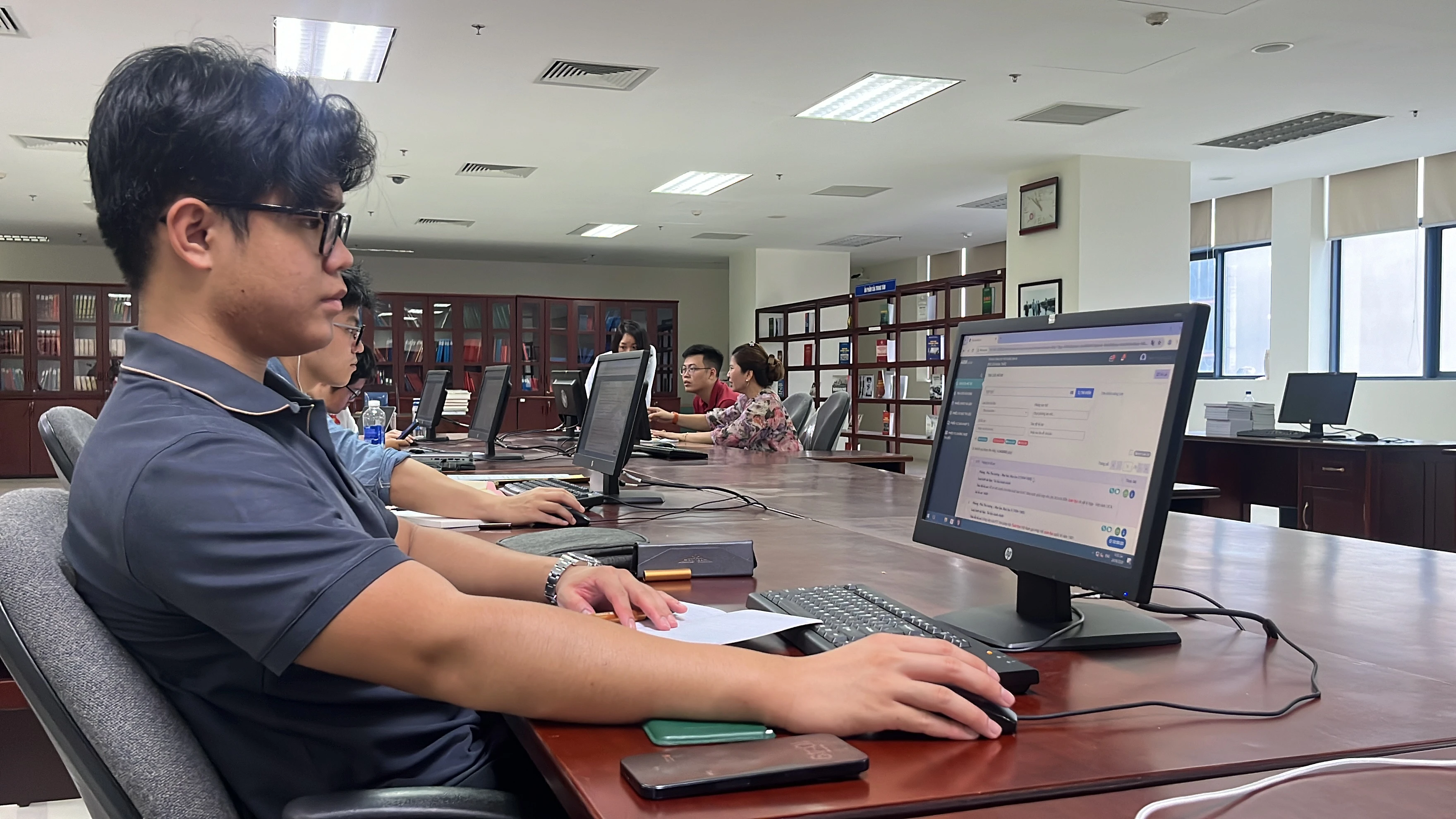 VietAlpha researchers working with historical artifacts at the National Archives Center III